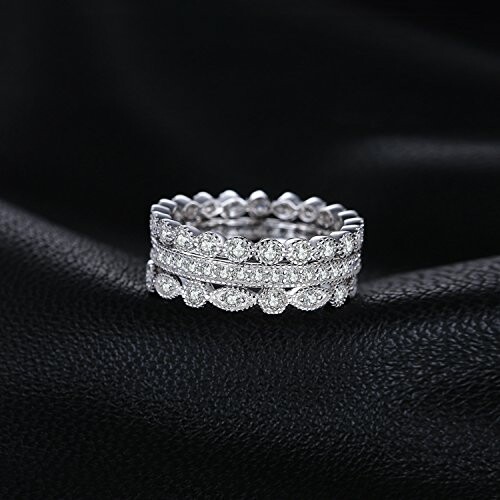 Diamond eternity ring on black fabric background