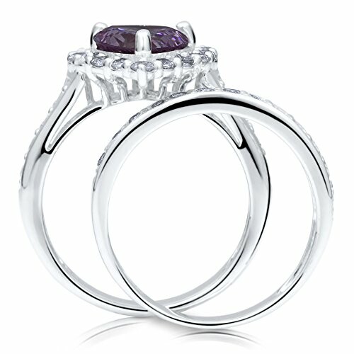 Elegant engagement ring with a purple stone and diamond accents.